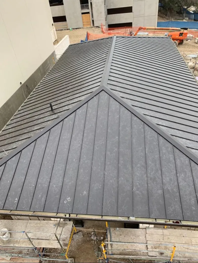 Commercial metal roof construction with crane equipment in Sun City Center