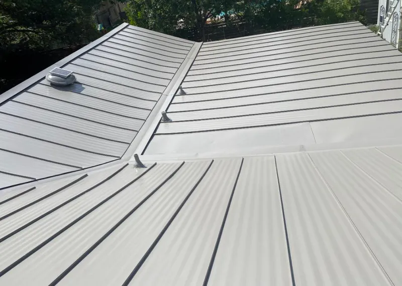 Solar attic fan installed on a metal roof for Roof Ventilation in Sun City Center